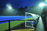 Floodlit pitch with dugouts